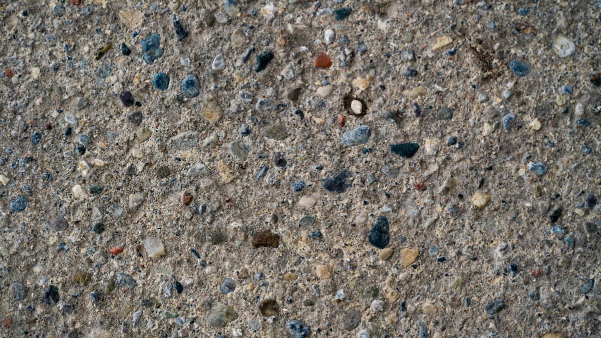 Sealed exposed aggregate concrete surface showing enhanced natural stone colours in Stratford, Ontario