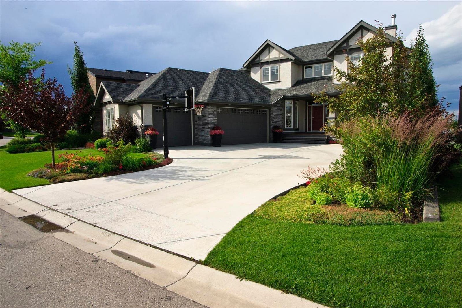 Broom finish concrete driveway at a two-storey home