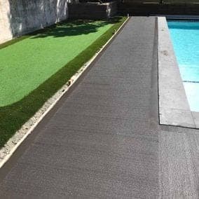 Broom finish concrete pool deck sealed in a matte finish for slip resistance