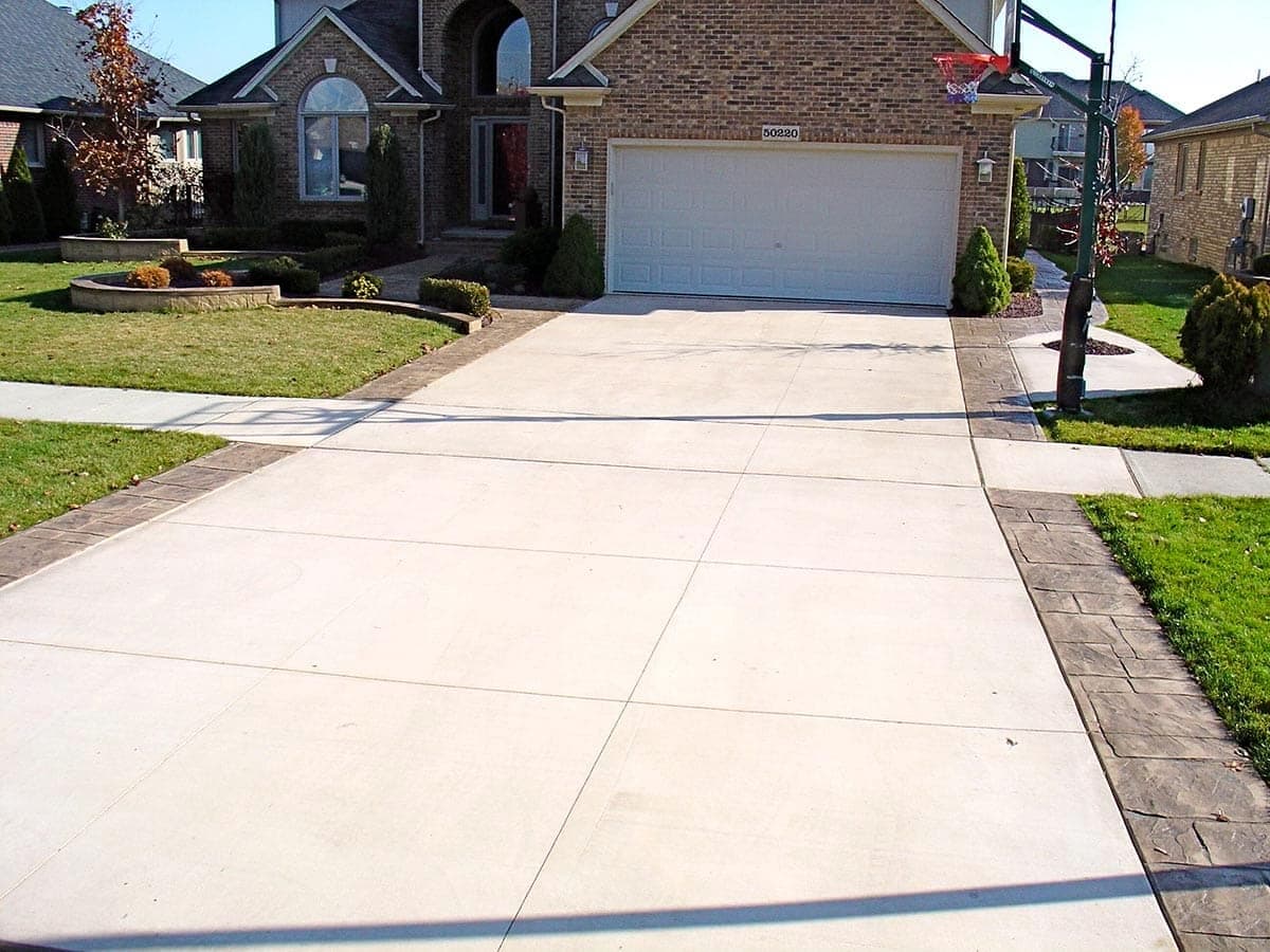 Concrete driveway with a stamped border ready for sealing
