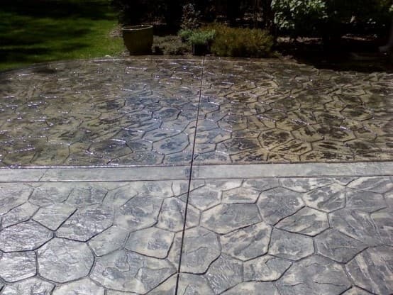 Freshly sealed concrete driveway with glossy protective finish in London, Ontario